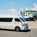 White Toyota Commuter van waiting to board Seatran Ferry at Donsak Pier to Koh Samui