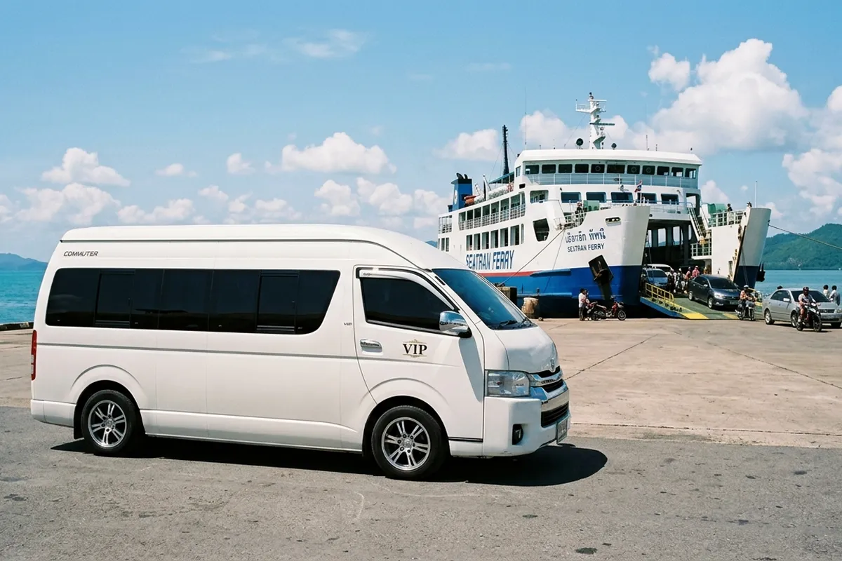 White Toyota Commuter van waiting to board Seatran Ferry at Donsak Pier to Koh Samui