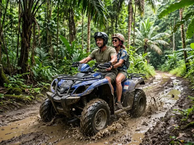 ATV Adventure Koh Lanta Couple riding blue Yamaha ATV through muddy jungle trail in Koh Lanta