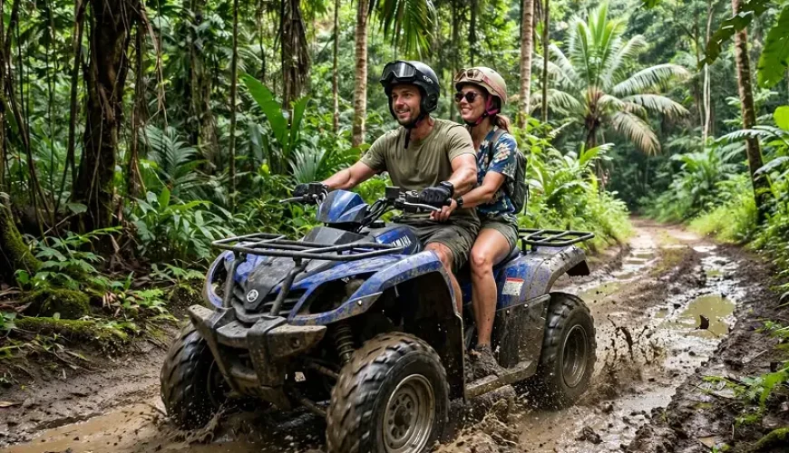 ATV Adventure Koh Lanta Couple riding blue Yamaha ATV through muddy jungle trail in Koh Lanta