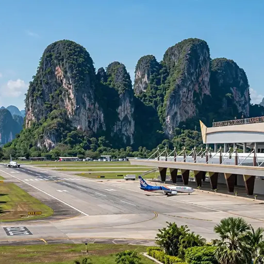 Krabi International Airport runway surrounded by tropical limestone mountains
