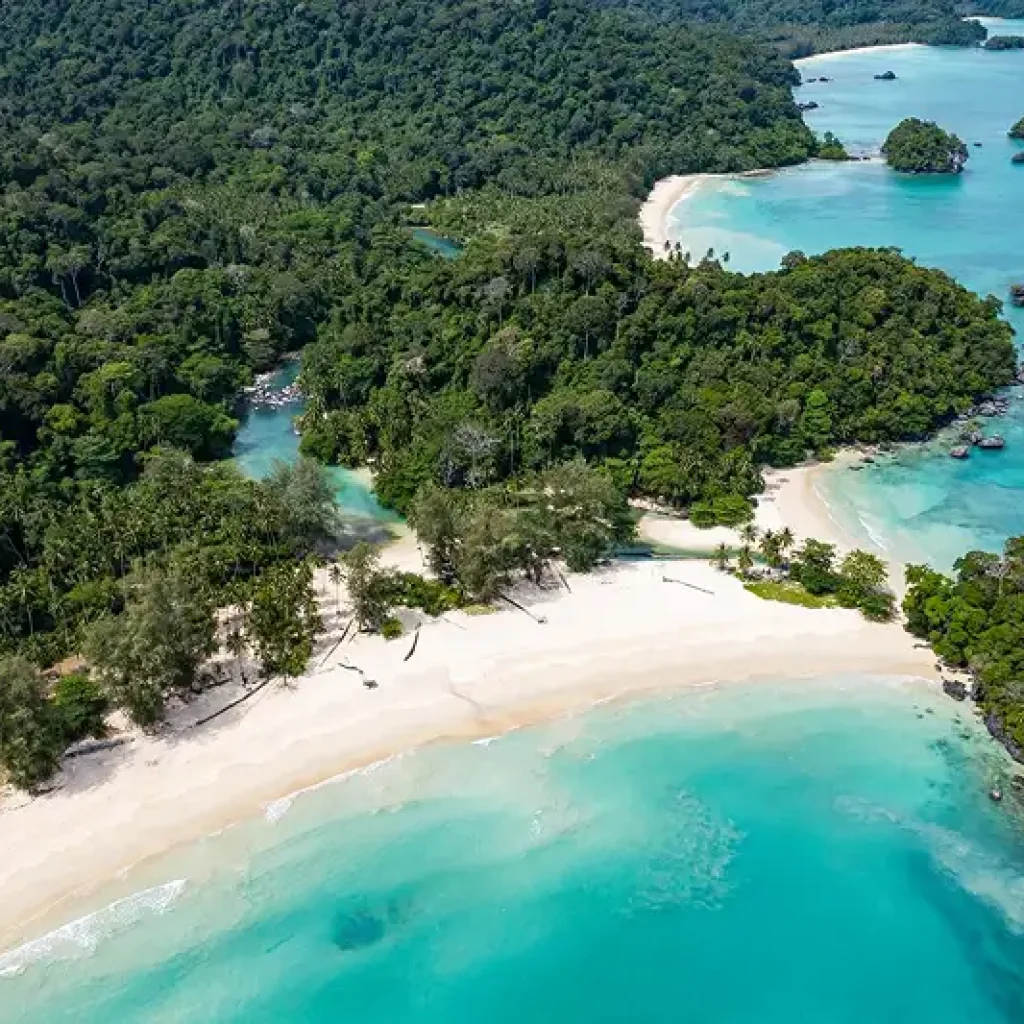 Aerial view of tropical island cove and white sand beach in Southern Thailand